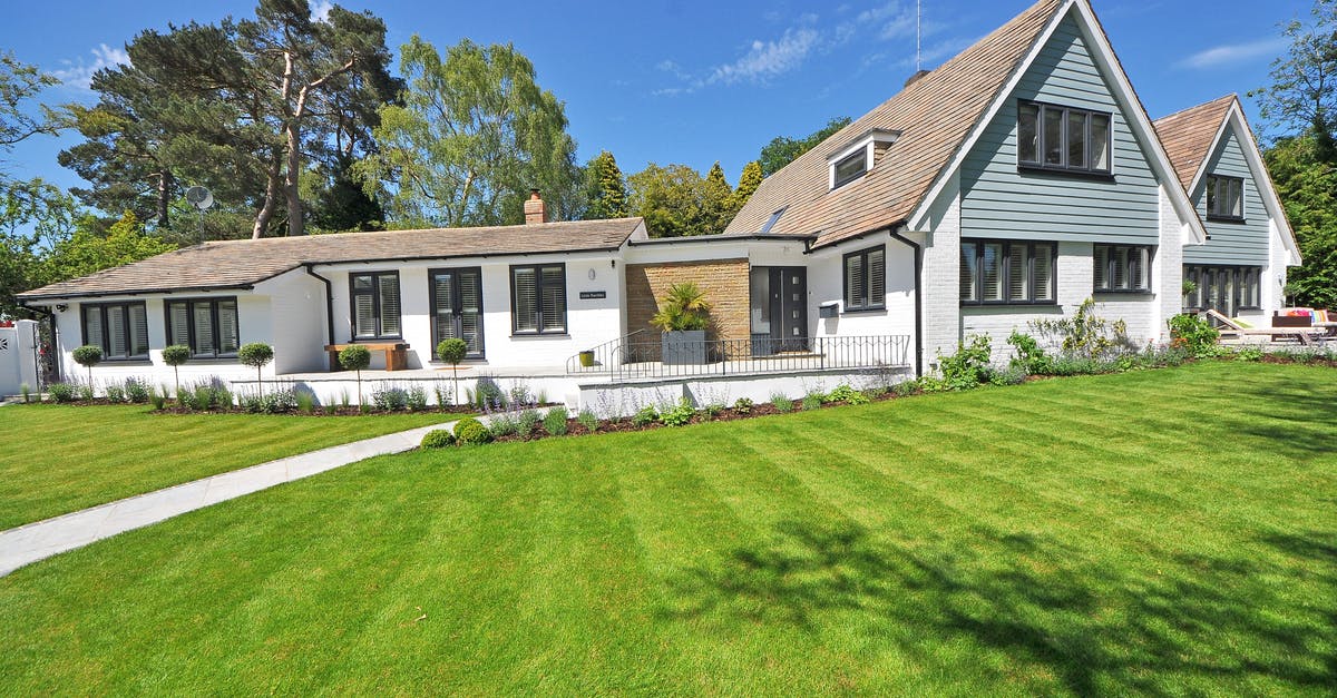 Refusal of EEA family permit - White Wooden 2-storey House Near Tree