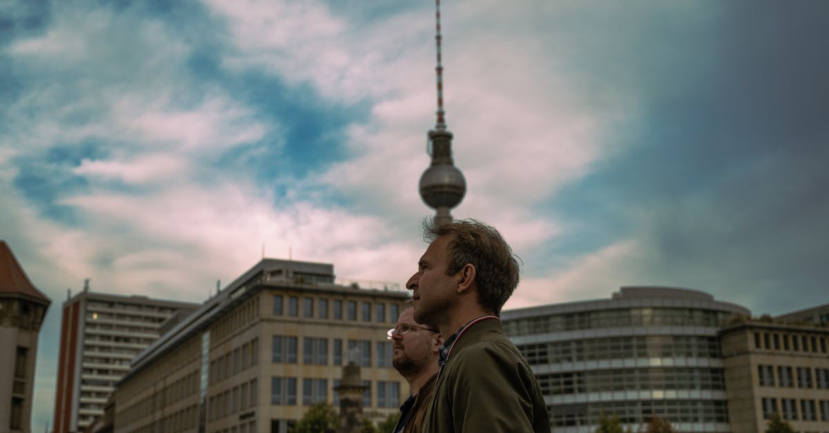 Refusal Of Visit Visa Germany [duplicate] - Two Men Standing on a City Street in Berlin 