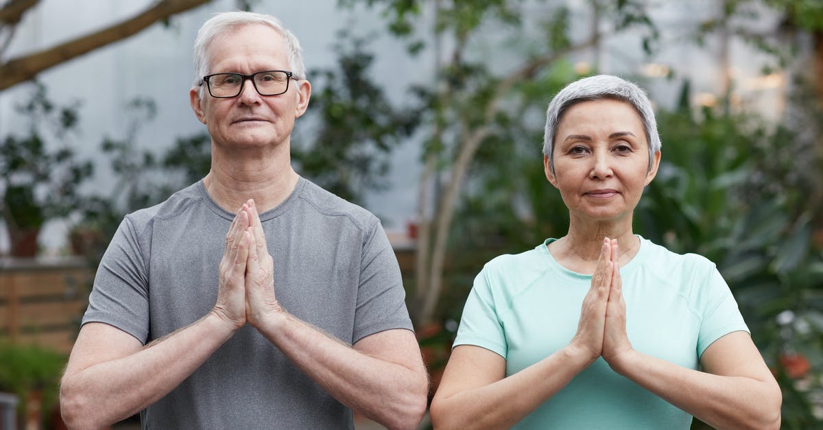 Refused family ticket due to not being a "family" - Couple Practicing Yoga