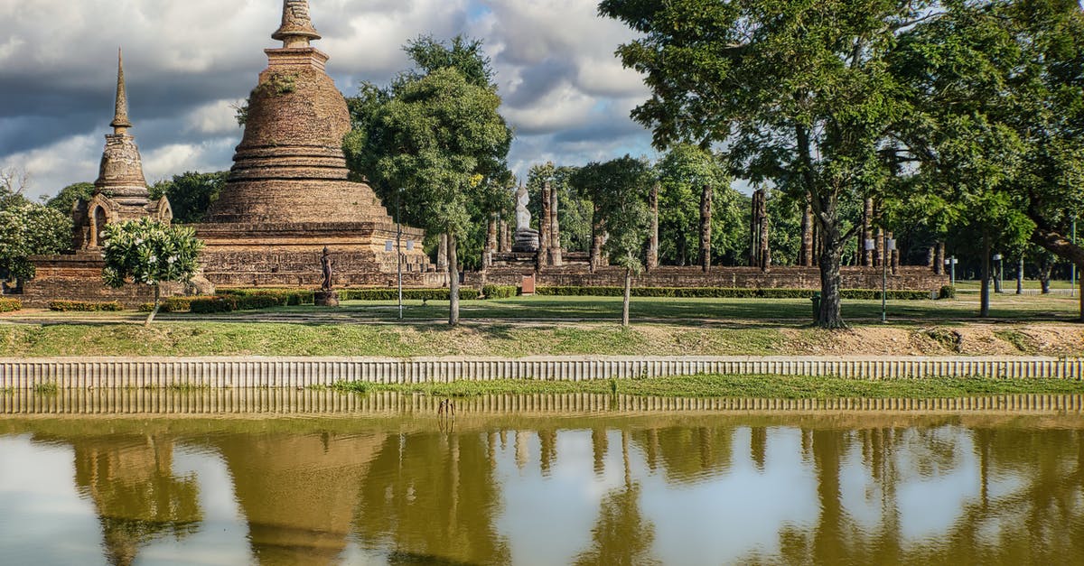 Regarding transit visa for Thailand - Brown Concrete Building Near Green Trees Under White Clouds and Blue Sky