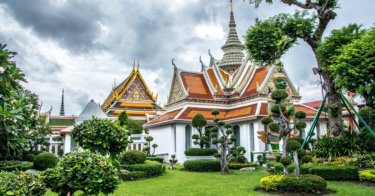 Regarding transit visa for Thailand - Green Trees Near Brown and White Concrete Building Under White Clouds