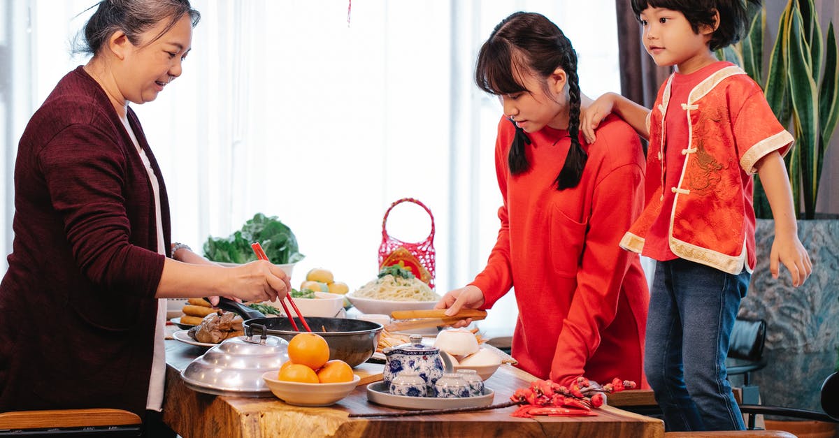 Registration process for tourists in South East Asian countries - Smiling Asian old woman cooking Chinese food for event