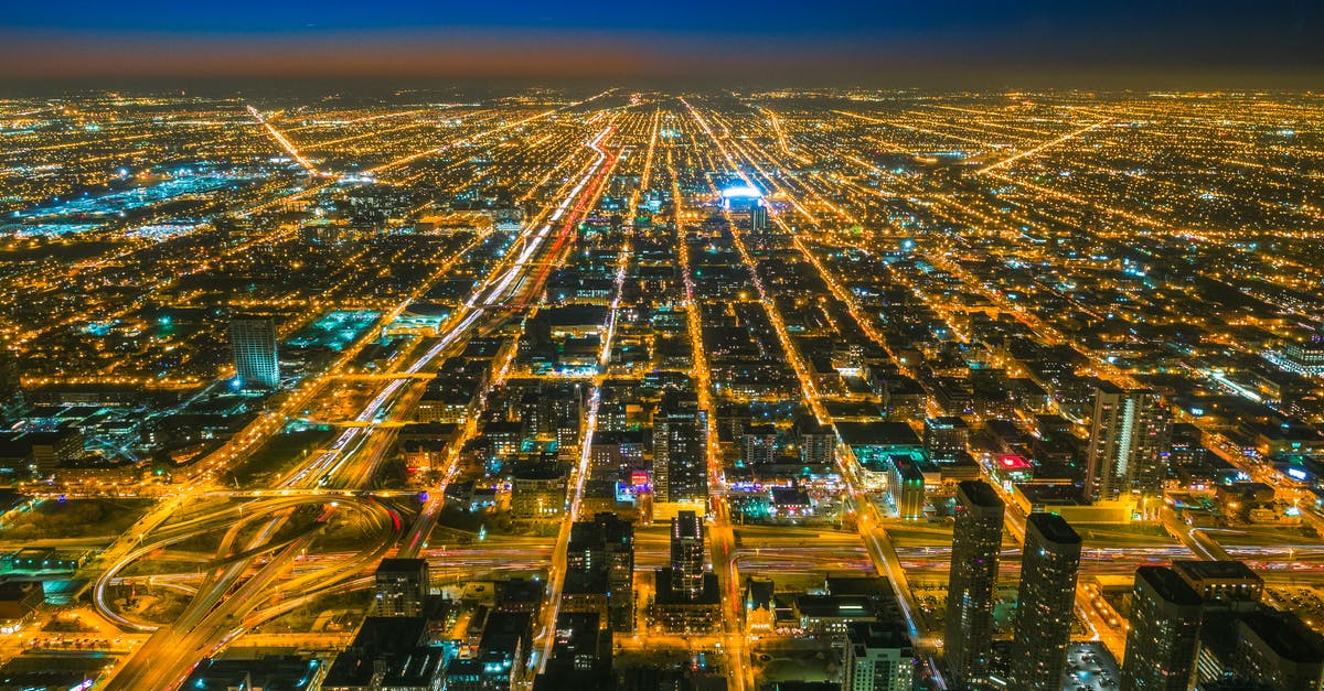 Reliability of greyhound/amtrak from Minneapolis to Chicago - Bird's Eye View Photography Of City With Lights