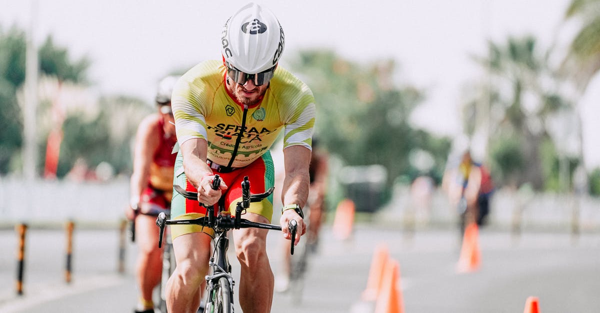 Rent a racing bicycle in the Eifel, Germany - Sportsman riding bike behind unrecognizable rivals during competition