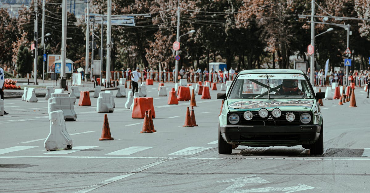 Renting a car in central Asia as an inexperienced driver - Old car racing on empty road