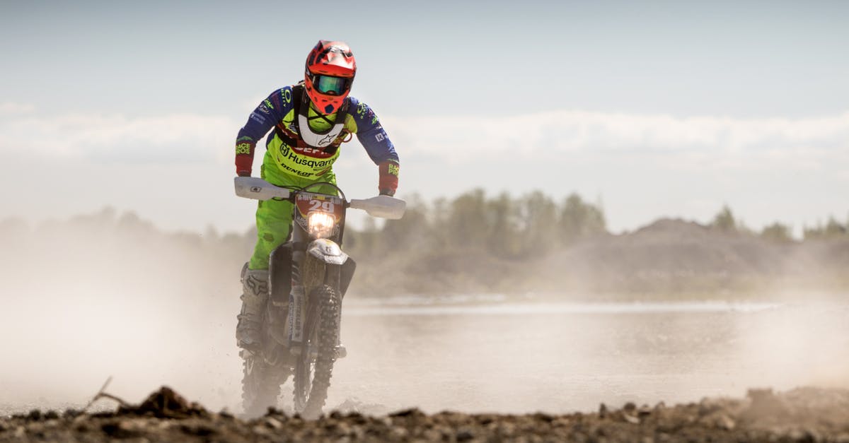 Renting a motorbike from a private person in Indonesia? - Person In Green Motocross Gear Riding A Dirt Bike