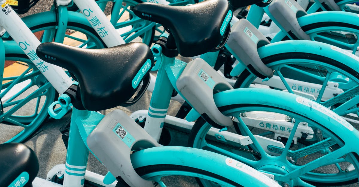 Renting bicycles in Leipzig - Teal Bicycles On A Parking Lot