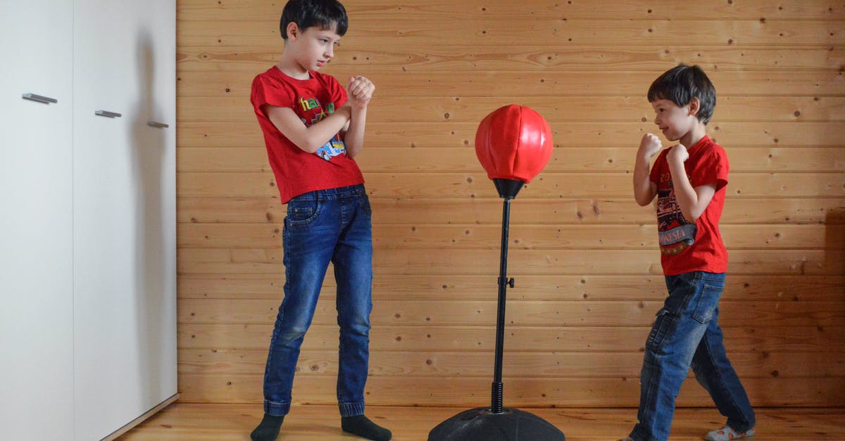 Reservations on TGV when delays require a different train? - Boys playing with punching bag on stand in boxing club