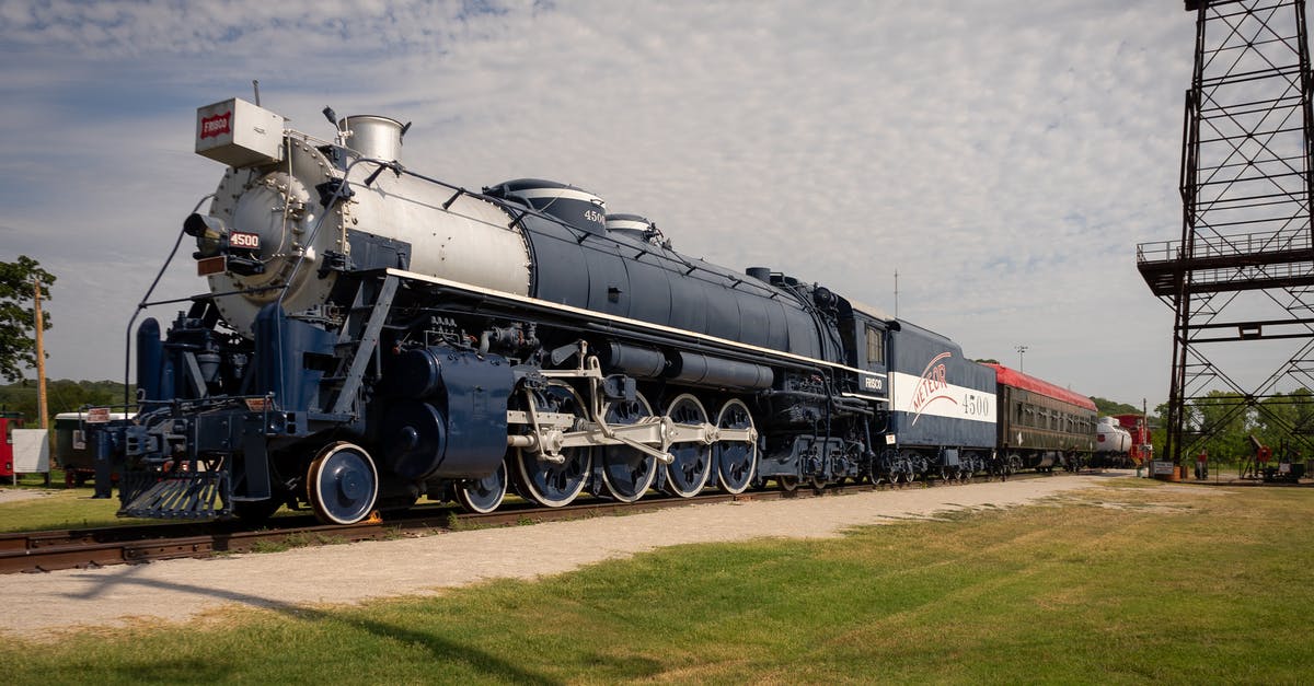 Resources for planning a western United States road trip [closed] - Black and Red Train on Rail Tracks Under White Clouds