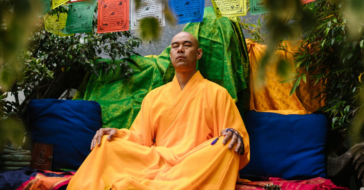 Retreat center for meditation near Frankfurt - Woman in Yellow Hijab Sitting on Blue Chair