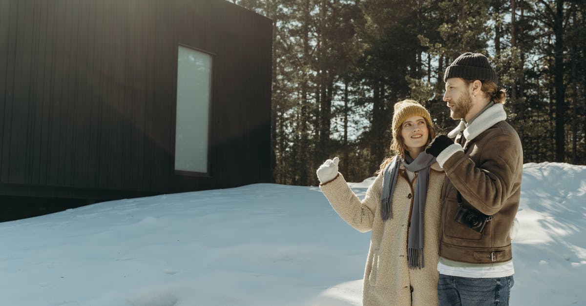 Revealing relationship on German visa application - Man in Brown Coat Standing on Snow Covered Ground