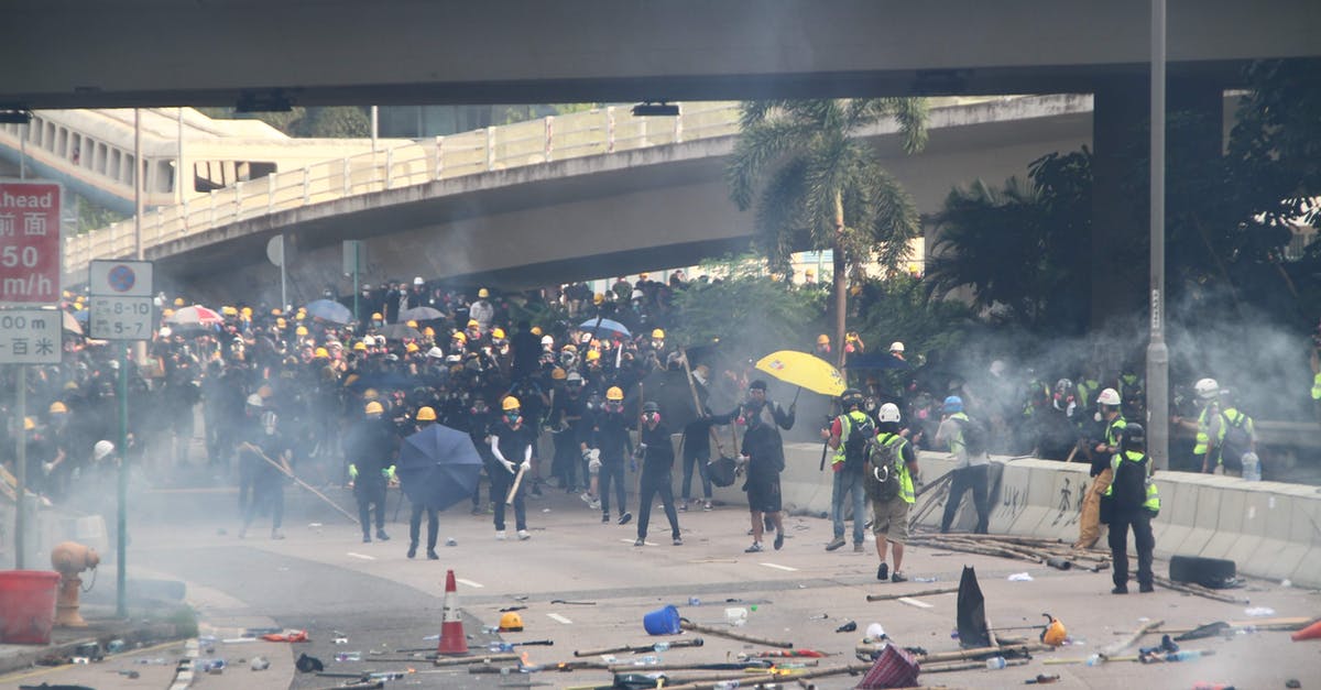 RFID blocking Passport wallets and trouble during security checks - Group of workers refusing to work and walking on streets to fight for rights and freedoms