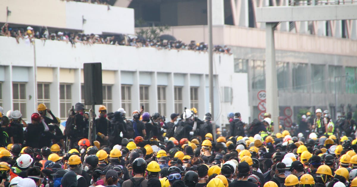 RFID blocking Passport wallets and trouble during security checks - Crowd of workers on mass meeting for rights