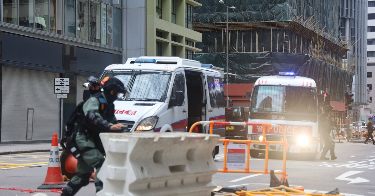 RFID blocking Passport wallets and trouble during security checks - Military removing fence for passage of police car