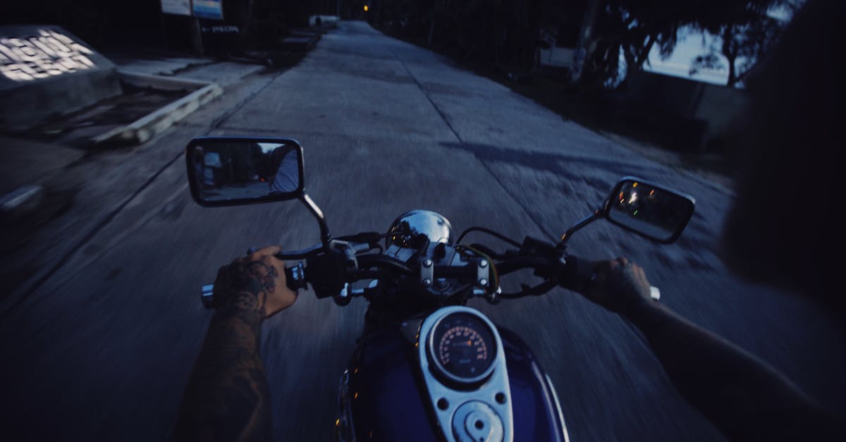 Riding an Abra at Night (Dubai) - Person Riding Motorcycle on Road during Night Time