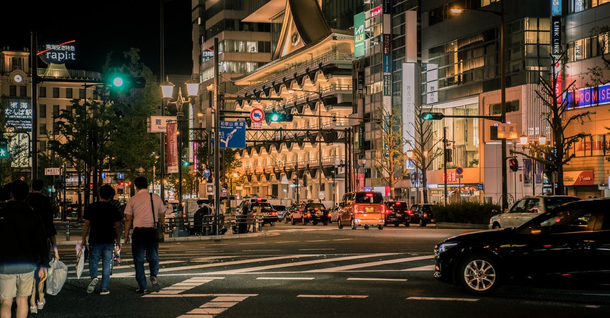 Roads in Japan during Golden Week - Brown and White Concrete Building