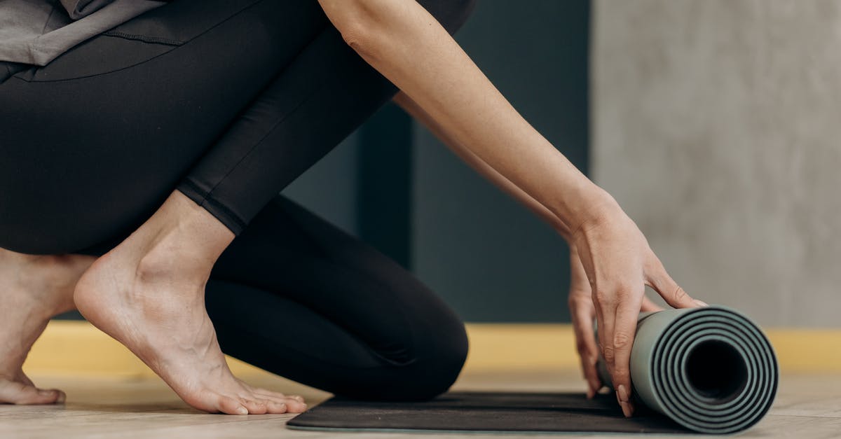 Rolling blackouts in the Philippines - Woman Unrolling A Yoga Mat