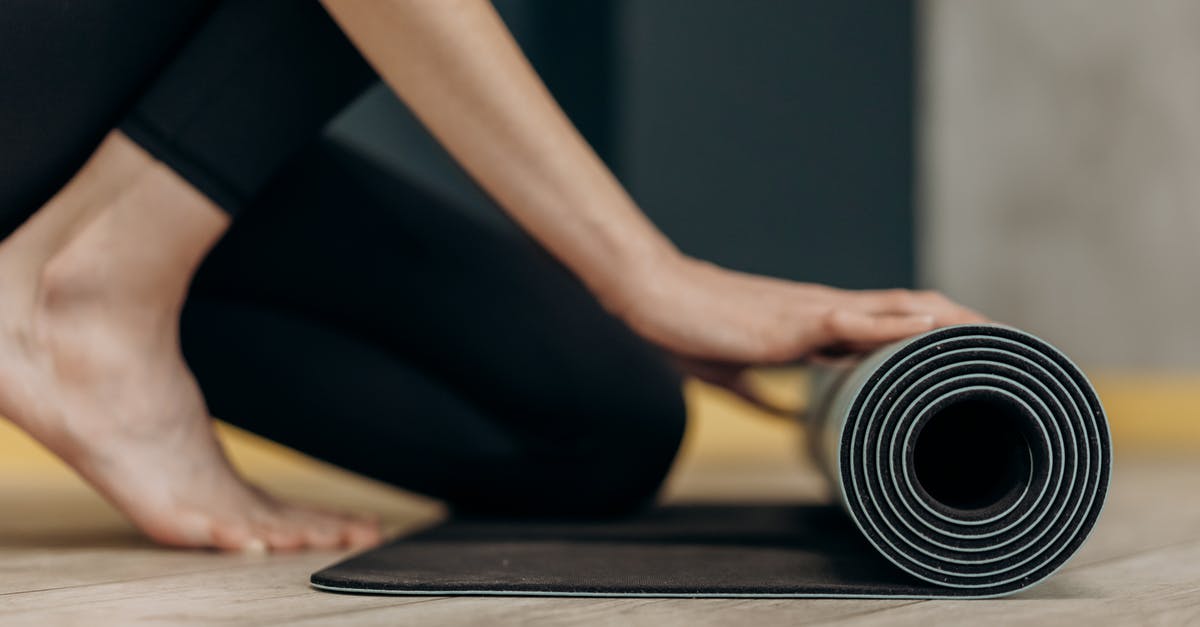 Rolling blackouts in the Philippines - Woman Rolling A Yoga Mat