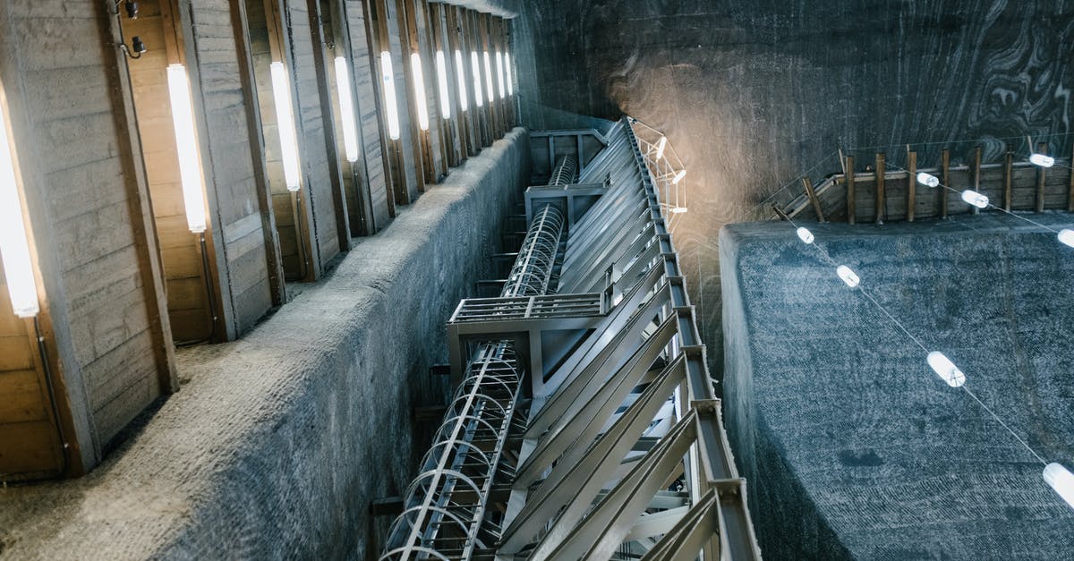 Romania - Travel Non EU Citizen - Metal construction inside of salt mine with lamps