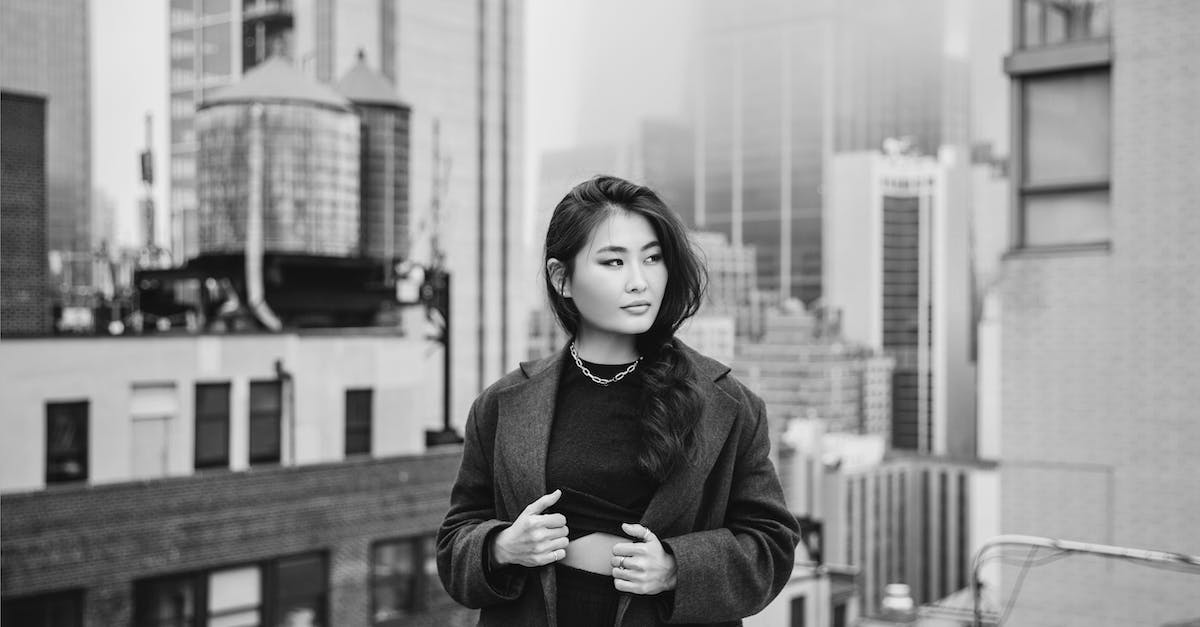 Rooftop bar in Manhattan? - A Woman in Gray Blazer Standing on the Rooftop