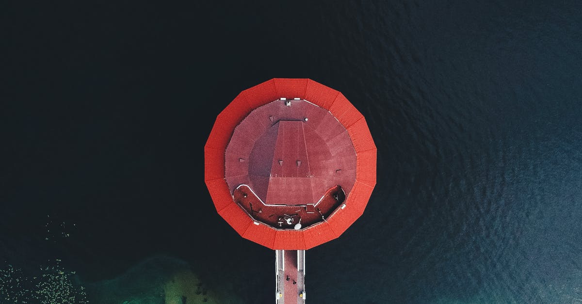 Rooftop restaurant in Santiago, Chile - Aerial view of round red roof of modern restaurant located in river water in Dnipro city