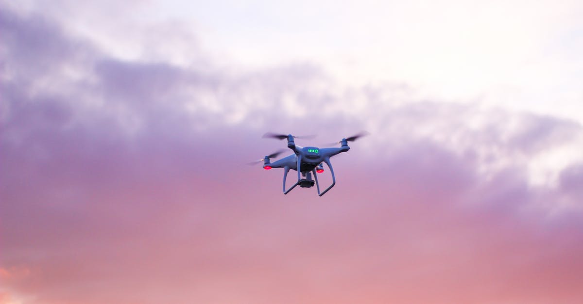 Rules Concerning Electronics Onboard US-Bound Direct Flights - Quadcopter Drone Flying Under Pink Sky