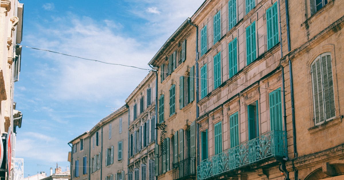 Russia to The Netherlands. What are the implications of changing from a hostel to a private apartment AFTER getting the visa and crossing the border? - Facade of classic buildings in city