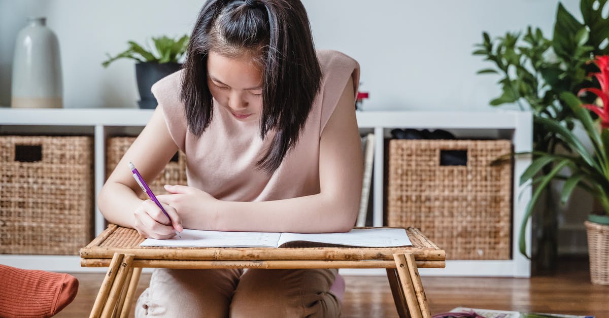 Russian student visa - A Girl Doing her Homework on a Bed Tray