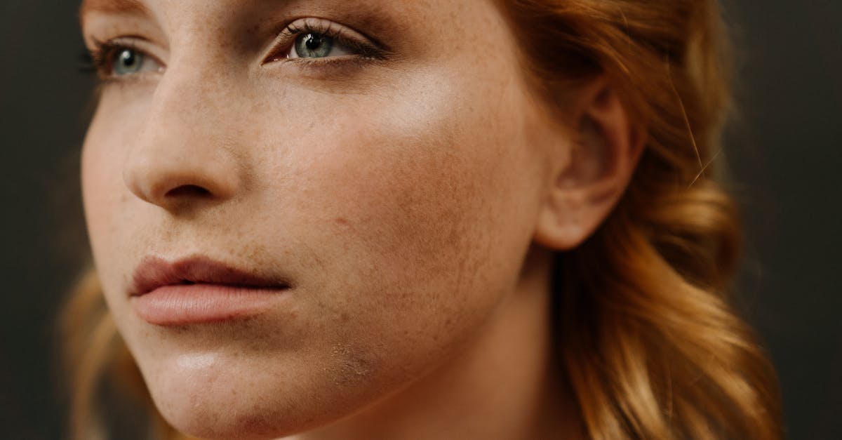 Russians leaving Russia (during covid times) - Woman With Brown Hair and Black Eye Shadow