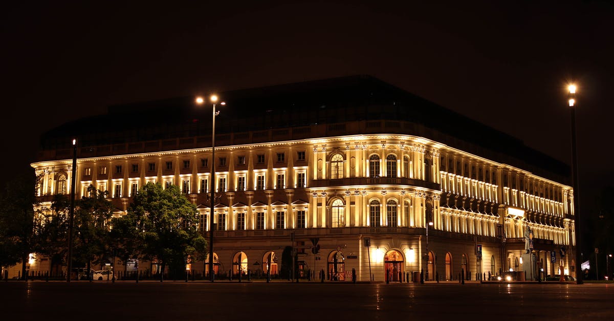 Safety in Warsaw Poland - White Concrete Building during Nighttime