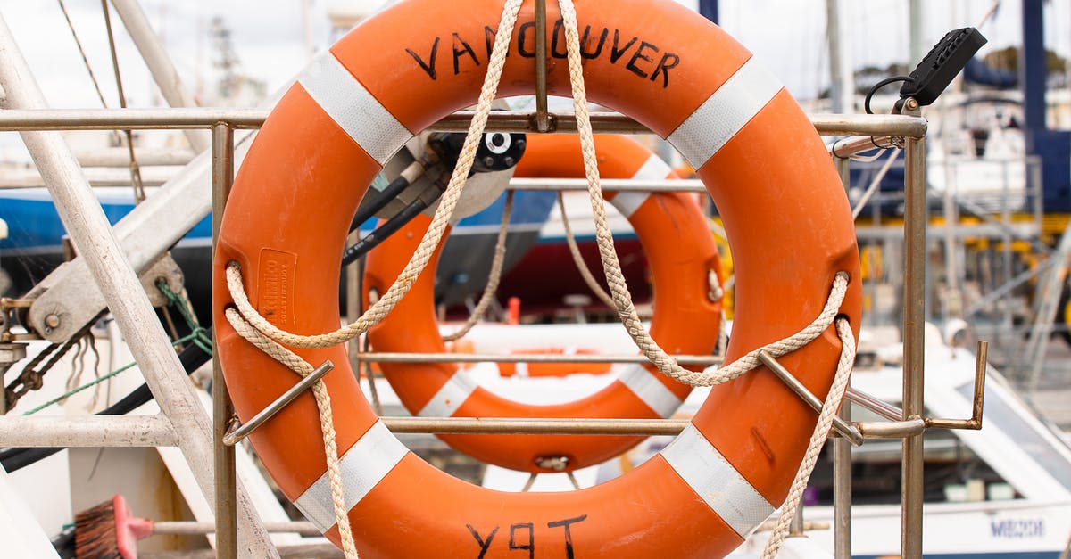 Sail own boat from Vancouver to Seattle [closed] - Orange Lifebuoy on a Silver Metal Fence