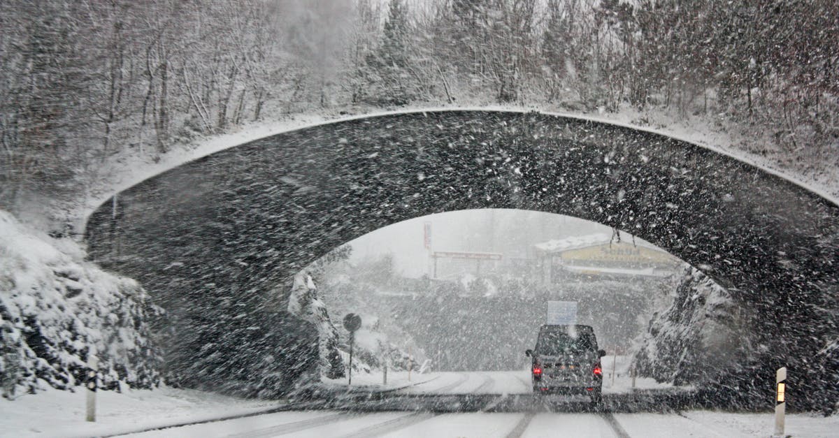 Salt Lake City driving in winter - Photo of White Vehicle Crossing a Tunnel 