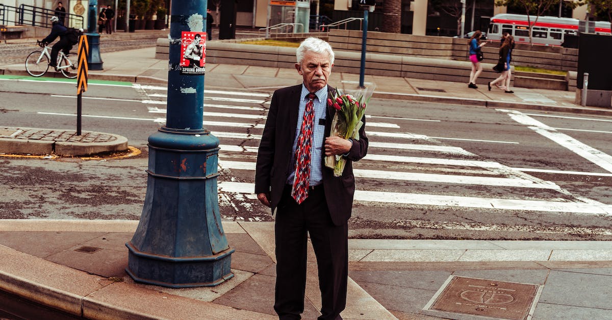 San Francisco to Singapore with a two-day stop in London - Man Holding Bouquet of Red Roses