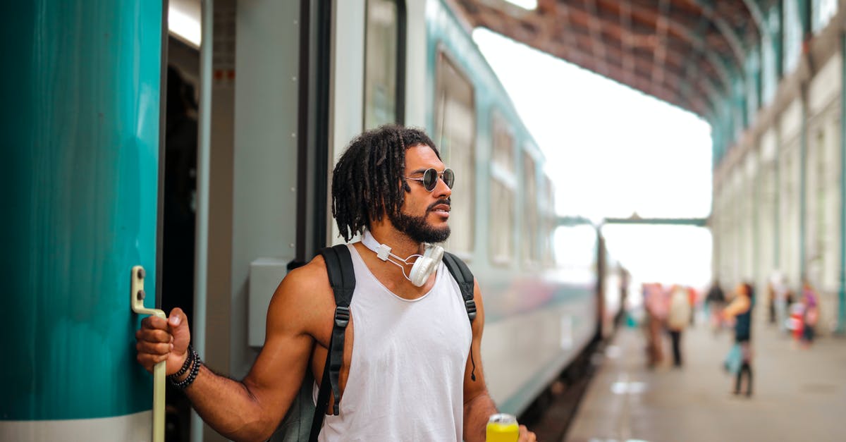 Saronno: what platform for MXP? [closed] - Man in White Tank Top Holding Yellow Tin Can