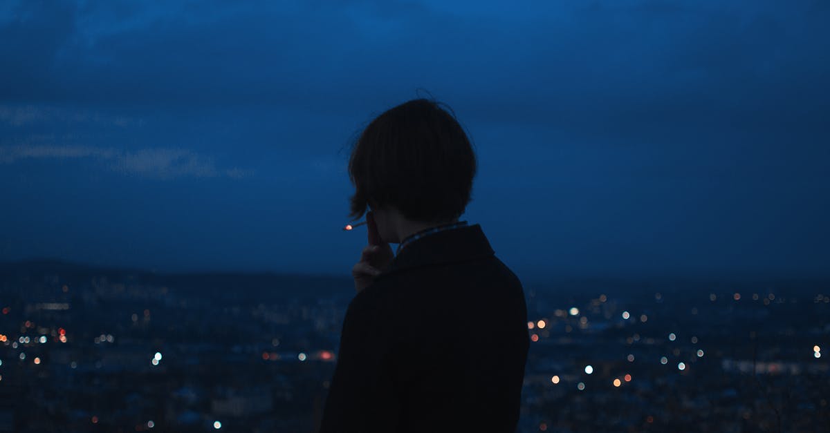 Scenic restaurant overlooking Washington DC - Person Smoking Across City Building during Nighttime