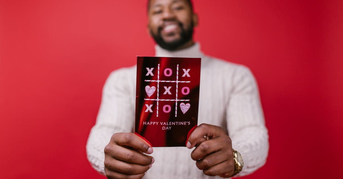 Schengen 90 days: what's counted? - Man in White Long Sleeve Shirt Holding Valentine's Day Card