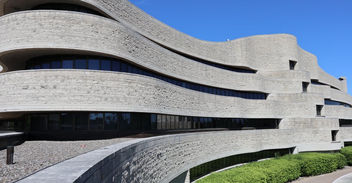 Schengen and Canada - Order of obtaining Visas - Brown Brick Building Under Blue Sky