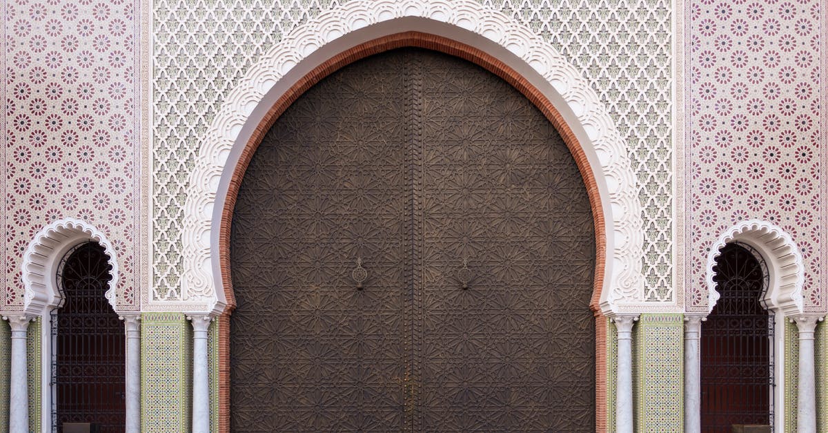 Schengen boarding/entry without visa for final destination (non-Schengen) - Ornamental facade of traditional Moroccan palace