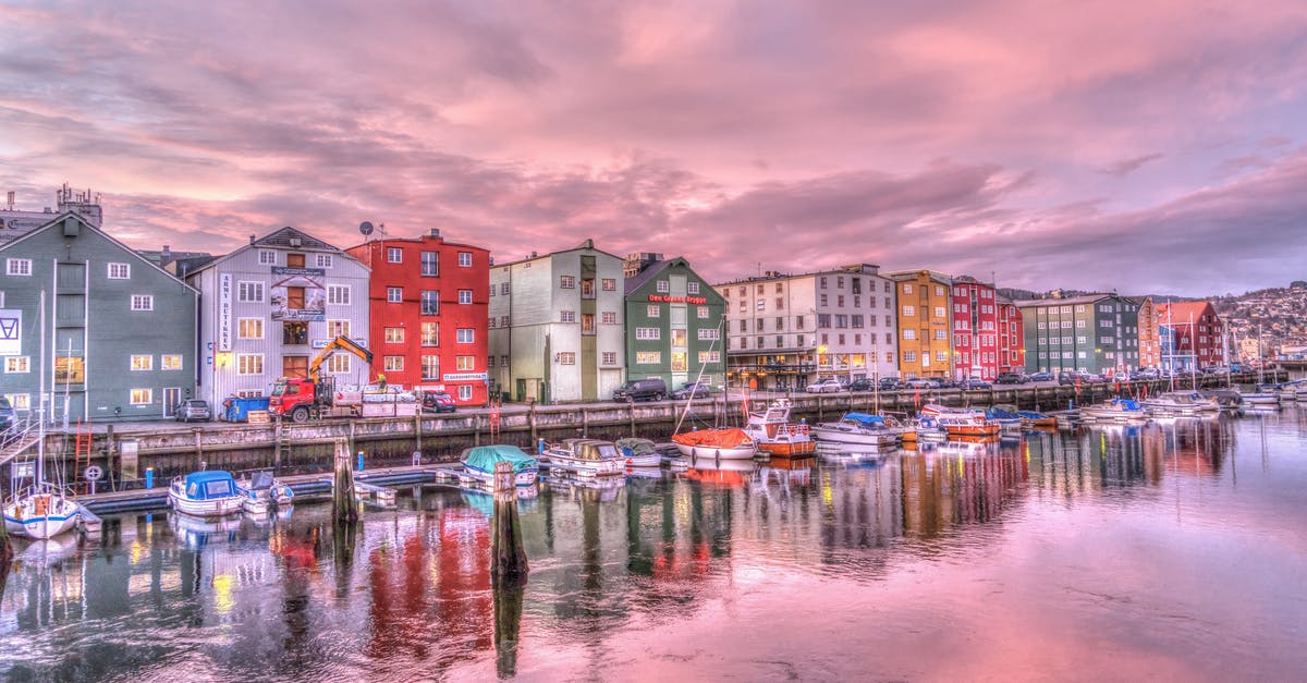 Schengen Business Visa Rejected from Norway Embassy - Reflection of Buildings in Water at Sunset