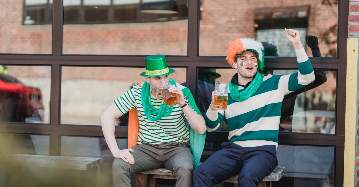 Schengen days and Ireland - Joyful men drinking beer and yelling on street during national festival party