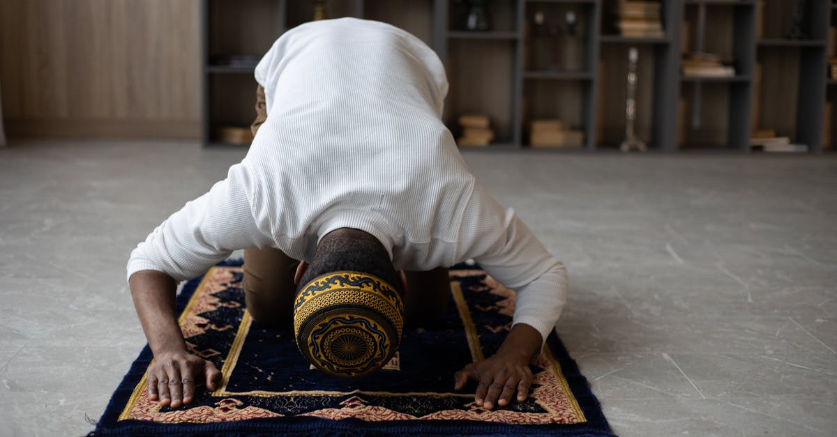 Schengen Greece Visa/passport withdrawal process - Muslim black man praying at home