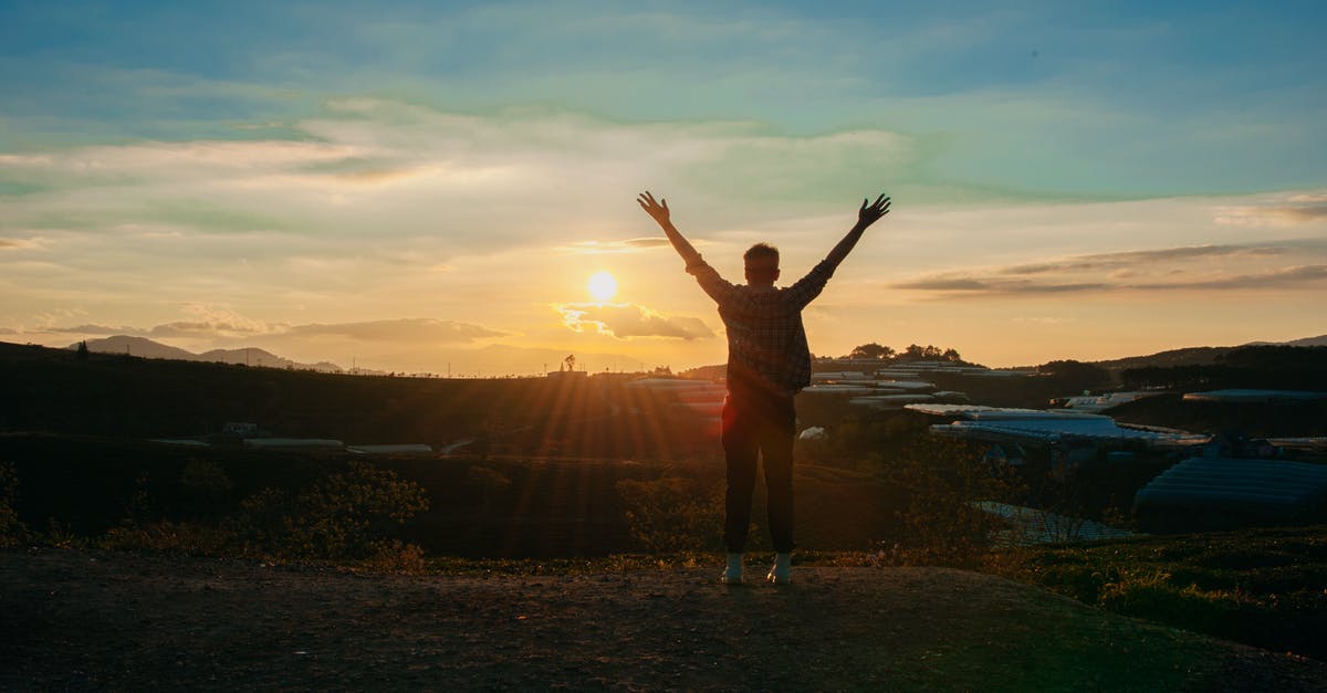 Schengen Multiple visa travel free countries - Photography of Man Raising Both Hands