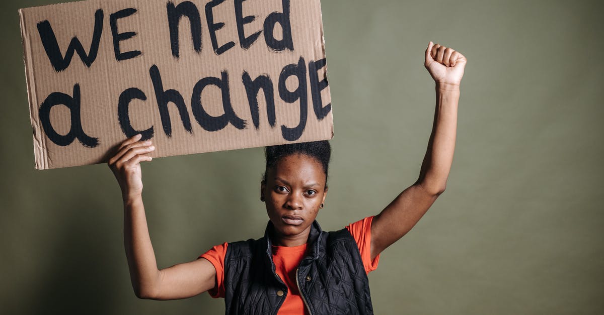 Schengen visa - explanatory statement needed? - A Woman Holding a Placard