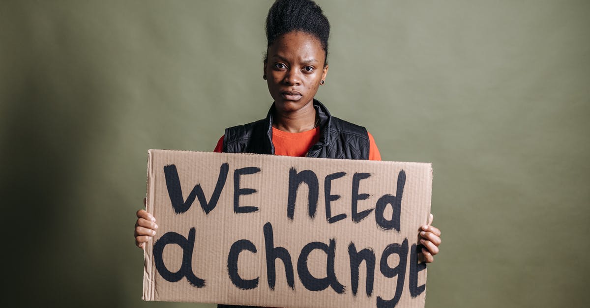 Schengen visa - explanatory statement needed? - A Woman Holding a Placard