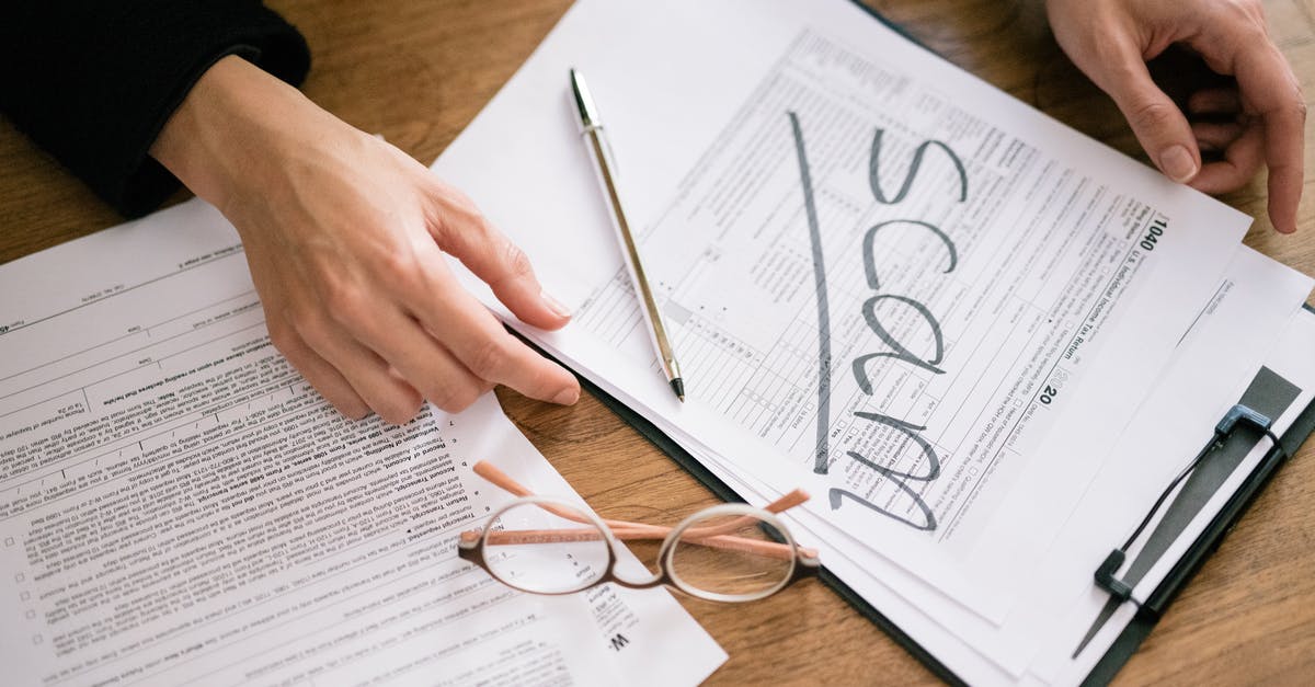 Schengen Visa - financial documents [duplicate] - Close-Up Shot of a Person Holding Documents