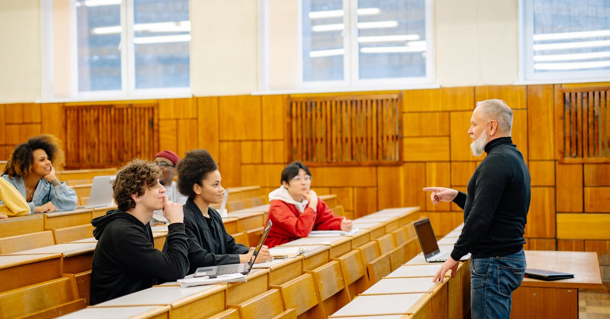 Schengen Visa and International Students - People Sitting on Brown Wooden Chairs