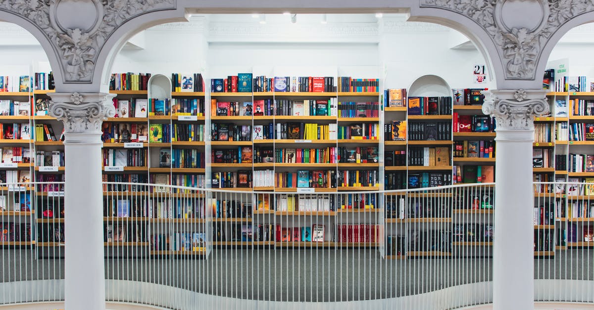 Schengen visa application in Romania - Books on Brown Wooden Shelf