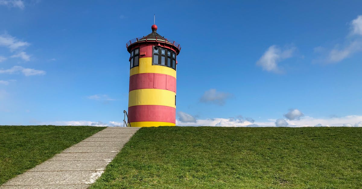 Schengen Visa for Germany refused due to lack of subsistence - Red White and Black Lighthouse Under Blue Sky