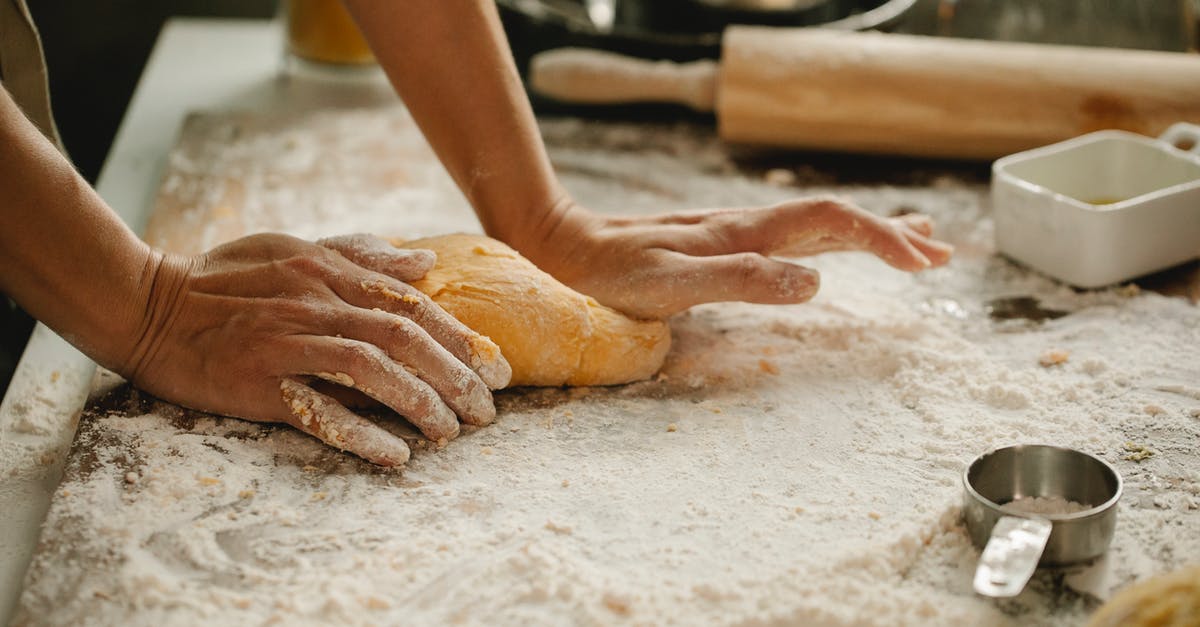 Schengen visa for housewife - Woman making pastry on table with flour