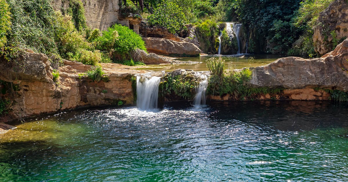 Schengen visa for Spain - Water Falls on Brown Rocky Mountain